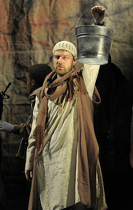 as Singer in <i>Caucasian Chalk Circle</i><br />Photo: Kevin Berne
